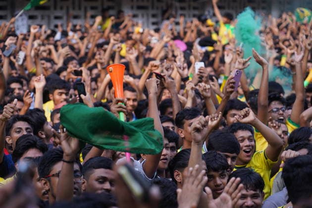 June 20, 2026, Dhaka, Dhaka, Bangladesh: Dhaka, Bangladesh, June 20, 2026: Football fans gather at the Teacher-Student Centre (TSC) of the University of Dhaka to watch the FIFA World Cup, WM, Weltmeisterschaft, Fussball match between Brazil and Haiti on a giant screen in Dhaka, Bangladesh. Thousands of supporters wearing Brazil s yellow and green colors cheered, waved flags, and celebrated throughout the match, creating a festive atmosphere at the venue. Following the game, jubilant fans took part in celebrations and victory processions, reflecting the enduring passion for football among Bangladeshi supporters. Dhaka Bangladesh - ZUMAk185 0859594278st Copyright: xRubelxKarmakerx