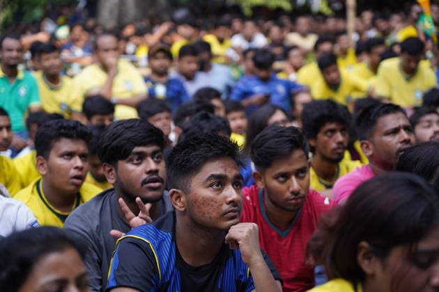 June 20, 2026, Dhaka, Dhaka, Bangladesh: Dhaka, Bangladesh, June 20, 2026: Football fans gather at the Teacher-Student Centre (TSC) of the University of Dhaka to watch the FIFA World Cup, WM, Weltmeisterschaft, Fussball match between Brazil and Haiti on a giant screen in Dhaka, Bangladesh. Thousands of supporters wearing Brazil s yellow and green colors cheered, waved flags, and celebrated throughout the match, creating a festive atmosphere at the venue. Following the game, jubilant fans took part in celebrations and victory processions, reflecting the enduring passion for football among Bangladeshi supporters. Dhaka Bangladesh - ZUMAk185 0859594382st Copyright: xRubelxKarmakerx