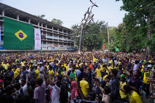 June 20, 2026, Dhaka, Dhaka, Bangladesh: Dhaka, Bangladesh, June 20, 2026: Football fans gather at the Teacher-Student Centre (TSC) of the University of Dhaka to watch the FIFA World Cup, WM, Weltmeisterschaft, Fussball match between Brazil and Haiti on a giant screen in Dhaka, Bangladesh. Thousands of supporters wearing Brazil s yellow and green colors cheered, waved flags, and celebrated throughout the match, creating a festive atmosphere at the venue. Following the game, jubilant fans took part in celebrations and victory processions, reflecting the enduring passion for football among Bangladeshi supporters. Dhaka Bangladesh - ZUMAk185 0859594401st Copyright: xRubelxKarmakerx