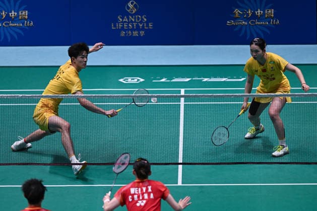 MACAO, CHINA - JUNE 19: Li Hongyi and Huang Kexin of China compete in the Mixed Doubles Quarterfinal match against Jiang Zhenbang and Wei Yaxin of China on day 4 of Macao Open Badminton 2026 at Macao East Asian Games Dome on June 19, 2026 in Macau, China.  Copyright: xVCGx 111649290092
