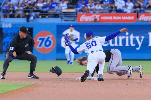 June 19, 2026, Los Angeles, California, USA: Mookie Betts 50 of the Los Angeles Dodgers catches the ball for an out on Taylor Ward 3 of the Baltimore Orioles on second base during a regular season MLB, Baseball Herren, USA game against the Baltimore Orioles on Friday June 19, 2026 at Dodger Stadium in Los Angeles, California. Dodgers defeat Orioles, 6-5. JAVIER ROJAS PI Los Angeles USA - ZUMAp124 20260619_zaa_p124_007 Copyright: xJavierxRojasx