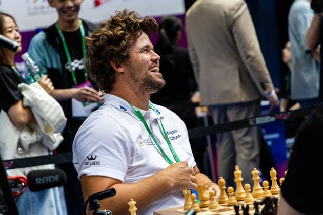 June 20, 2026, Hong Kong, Hong Kong, China: Chess Grandmaster MAGNUS CARLSEN (NOR) laughs while talking with his teammates about chess before a Blitz match at the 2026 FIDE World Team Rapid and Blitz Chess Championship in Hong Kong.Chess Hong Kong China - ZUMAm298 0859595564st Copyright: xJamesxModestox