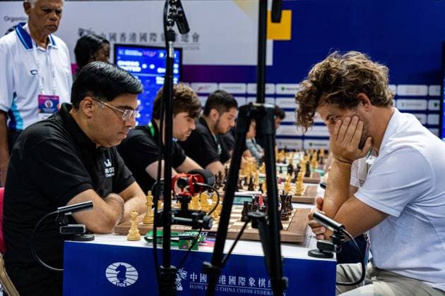 June 20, 2026, Hong Kong, Hong Kong, China: Chess Grandmasters MAGNUS CARLSEN (NOR) and VISWANATHAN ANAND (IND) duel in a Blitz match at the 2026 FIDE World Team Rapid and Blitz Chess Championship in Hong Kong.Chess Hong Kong China - ZUMAm298 0859595922st Copyright: xJamesxModestox