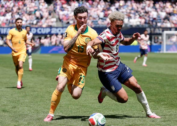 (260620) -- SEATTLE, June 20, 2026 -- Connor Metcalfe (L) of Australia vies with Antonee Robinson of the United States during the group D match between the United States and Australia at the 2026 FIFA World Cup, WM, Weltmeisterschaft, Fussball at Seattle Stadium in Seattle, the United States, June 19, 2026. (Photo by Xinhua) (SP)U.S.-SEATTLE-FOOTBALL-FIFA WORLD CUP-GROUP D-USA VS AUS ArthurxDong 