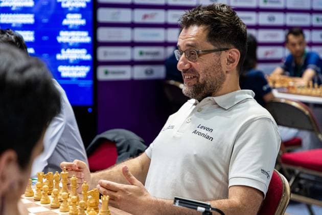 June 20, 2026, Hong Kong, Hong Kong, China: Chess Grandmaster LEVON ARONIAN (USA) jokes with his teammates and the opposing team about hockey before a Blitz match at the 2026 FIDE World Team Rapid and Blitz Chess Championship in Hong Kong. Hong Kong China - ZUMAm298 0859596943st Copyright: xJamesxModestox