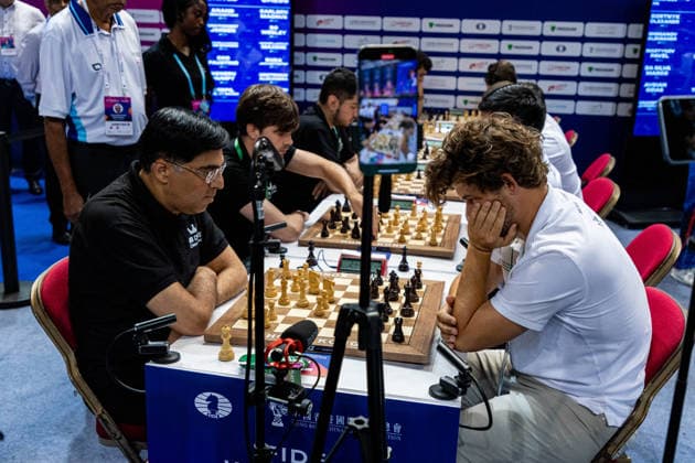 June 20, 2026, Hong Kong, Hong Kong, China: Chess Grandmasters MAGNUS CARLSEN (NOR) and VISWANATHAN ANAND (IND) duel in a Blitz match at the 2026 FIDE World Team Rapid and Blitz Chess Championship in Hong Kong. Hong Kong China - ZUMAm298 0859596951st Copyright: xJamesxModestox