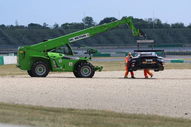 Bastian Buus (DK Land-Motorsport, 29), Porsche 911 GT3 R Evo, lands in the gravel bed, is dragged off the track, DTM (German Touring Car Championship) - Round 3 - Race 1, DEKRA Lausitzring on 20.06.2026. Brandenburg Deutschland Copyright: xO.Frankex