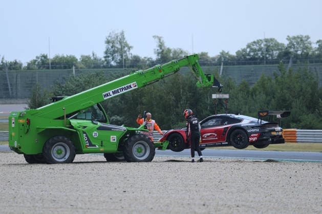 Bastian Buus (DK Land-Motorsport, 29), Porsche 911 GT3 R Evo, lands in the gravel bed, is dragged off the track, DTM (German Touring Car Championship) - Round 3 - Race 1, DEKRA Lausitzring on 20.06.2026. Brandenburg Deutschland Copyright: xO.Frankex