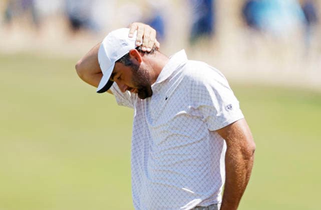 Scottie Scheffler reacts after hitting an approach shot to the first hole in the third round of the 126th U.S. Open Golf Championship at Shinnecock Hills Golf Club in Southampton, NY on Saturday, June 20, 2026.  NYC202606202003 JOHNxANGELILLO