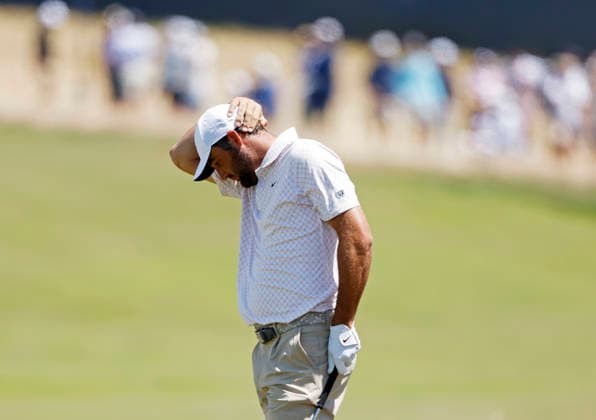 Scottie Scheffler reacts after hitting an approach shot to the first hole in the third round of the 126th U.S. Open Golf Championship at Shinnecock Hills Golf Club in Southampton, NY on Saturday, June 20, 2026.  NYC202606202002 JOHNxANGELILLO