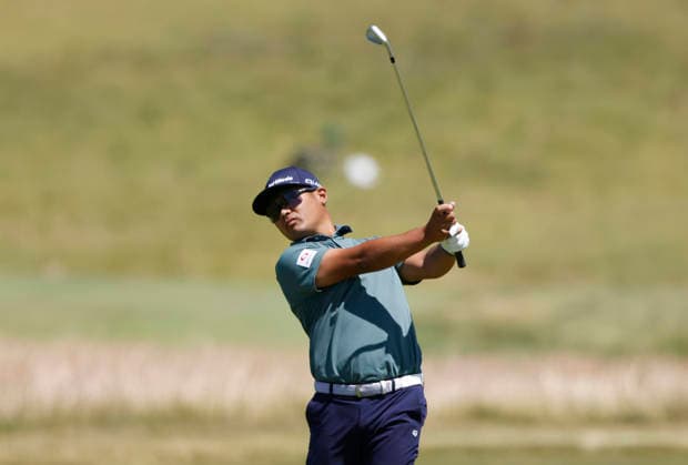 Ryo Hisatsune of Japan hits an approach shot to the first hole in the third round of the 126th U.S. Open Golf Championship at Shinnecock Hills Golf Club in Southampton, NY on Saturday, June 20, 2026.  NYC202606202005 JOHNxANGELILLO