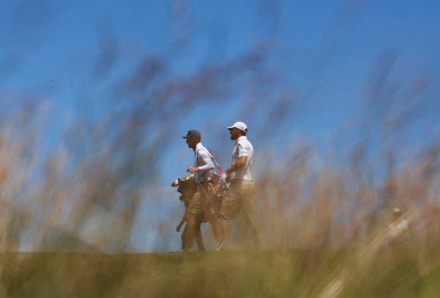 Scottie Scheffler walks to the to the first hole green in the third round of the 126th U.S. Open Golf Championship at Shinnecock Hills Golf Club in Southampton, NY on Saturday, June 20, 2026.  NYC202606202010 JOHNxANGELILLO