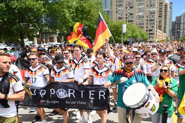 June 20, 2026, Toronto, On, Canada: Team Germany fans march toward Toronto Stadium before their team takes on Ivory Coast in World Cup soccer action in Toronto on Saturday, June 20, 2026. Canada News - June 20, 2026  - ZUMAc35_ 20260620_zaf_c35_017 Copyright: xJonxBlackerx