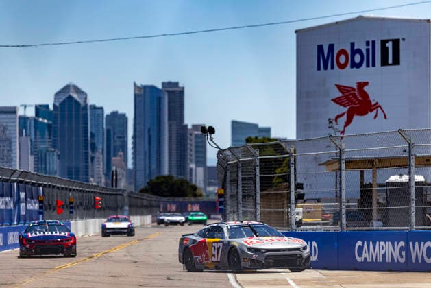 SAN DIEGO, CA - JUNE 20: Shane Van Gisbergen of the 97 Trackhouse Racing Red Bull Chevrolet leads the pack during qualifying for the Anduril 250 NASCAR, Motorsport, USA Cup Series Race, Saturday, June 20, 2026, at Naval Base Coronado in San Diego, California. Van Gisbergen took the pole for the race Sunday. (Photo by Tony Ding Icon Sportswire) AUTO: JUN 20 NASCAR Cup Series Anduril 250 Race the Base EDITORIAL USE ONLY Icon46520260620002250