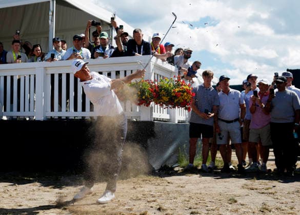 Spectators watch Sam Stevens hit from the rough to the first hole in the third round of the 126th U.S. Open Golf Championship at Shinnecock Hills Golf Club in Southampton, NY on Saturday, June 20, 2026.  NYC202606202017 JOHNxANGELILLO