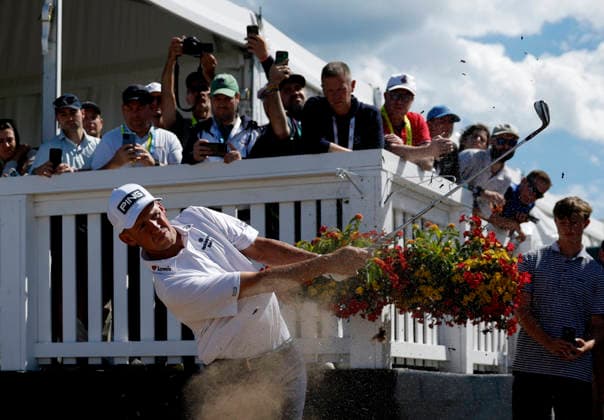 Spectators watch Sam Stevens hit from the rough to the first hole in the third round of the 126th U.S. Open Golf Championship at Shinnecock Hills Golf Club in Southampton, NY on Saturday, June 20, 2026.  NYC202606202018 JOHNxANGELILLO