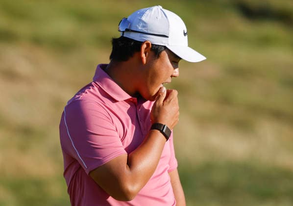 Tom Kim of South Korea prepares to putt on the 14th green during the third round of the 126th U.S. Open Golf Championship at Shinnecock Hills Golf Club in Southampton, NY, on Saturday, June 20, 2026.  NYC20260620818 JOHNxANGELILLO
