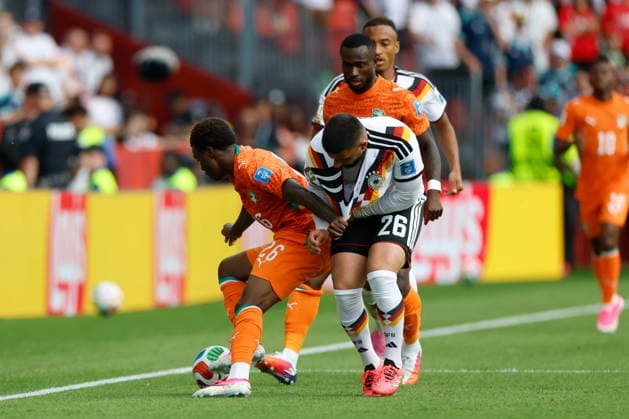 TORONTO STADIUM TORONTO ONTARIO KANADA 20.06.2026 FIFA MISTRZOSTWA SWIATA 2026 W PILKA NOZNA W KANADA MECZ GRUPA E GERMANY I COTE DIVOIRE FIFA World Cup, WM, Weltmeisterschaft, Fussball 2026 Group E match between Germany and CÃ te d Ivoire at Toronto Stadium in Toronto Canada on June 20, 2026 in Toronto, Ontario, Canada. N Z CÃ te d Ivoire midfielder Christ Inao OulaÃ¯ (26) Germany forward Deniz Undav (26) FOT. KAMIL KRZACZYNSKI NEWSPIX.PL --- newspix.pl Austria, Germany, France, Japan and Poland Rights OUT! POLAND OUT!  KSK