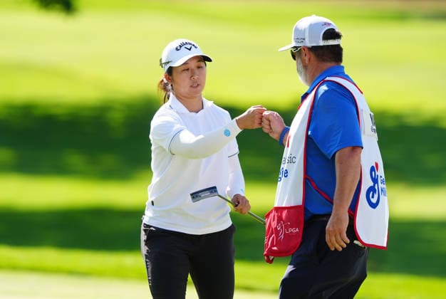 BELMONT, MI - JUNE 20: LPGA, Golf Damen player Jing Yan fist bumps her caddie after making a par saving putt on the 17th hole on June 20, 2026, during the third round of the LPGA Meijer LPGA Classic for Simply Give at Blythefield Country Club in Belmont, Michigan. (Photo by Brian Spurlock Icon Sportswire) GOLF: JUN 20 LPGA Meijer LPGA Classic for Simply Give EDITORIAL USE ONLY Icon26062042