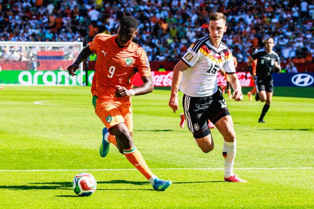 TORONTO, ON - JUNE 20: Forward Ange-Yoan Bonny (9) of Cote d Ivoire and defender Nico Schlotterbeck (15) of Germany are seen during first-half stoppage time of the FIFA World Cup, WM, Weltmeisterschaft, Fussball 2026 Group E match between Germany and Cote d Ivoire on June 20, 2026, at Toronto Stadium in Toronto, ON. (Photo by Mathew Tsang Icon Sportswire) SOCCER: JUN 20 FIFA World Cup 26 Group E - Germany vs Cote d Ivoire EDITORIAL USE ONLY Icon260620012