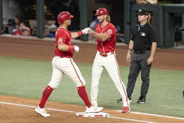 June 20, 2026, Arlington, Texas, USA: Texas Rangers third baseman JOSH JUNG (6) celebrates with Texas Rangers first base coach TRAVIS JANKOWSKI (96) after hitting a single during a MLB, Baseball Herren, USA game between the San Diego Padres and Texas Rangers at Globe Life Field. San Diego wins in extra innings 6-4. Arlington USA - ZUMAf180 20260620_zsp_f180_008 Copyright: xMarkxFannx