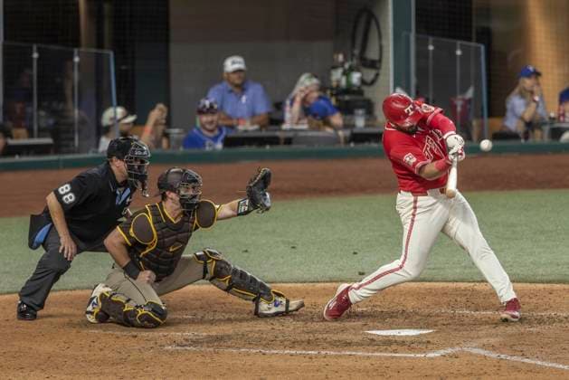 June 20, 2026, Arlington, Texas, USA: Texas Rangers first baseman JAKE BURGER (21) hits a two run homerun during a MLB, Baseball Herren, USA game between the San Diego Padres and Texas Rangers at Globe Life Field. San Diego wins in extra innings 6-4. MLB 2026: Padres 6:4 Rangers  - ZUMAf180 20260620_zsp_f180_007 Copyright: xMarkxFannx