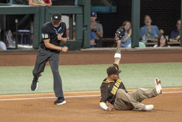 June 20, 2026, Arlington, Texas, USA: Texas Rangers center fielder WYATT LANGFORD (36) gets tagged out by San Diego Padres third baseman MANNY MACHADO (13) during a MLB, Baseball Herren, USA game between the San Diego Padres and Texas Rangers at Globe Life Field. San Diego wins in extra innings 6-4. Arlington USA - ZUMAf180 20260620_zsp_f180_024 Copyright: xMarkxFannx