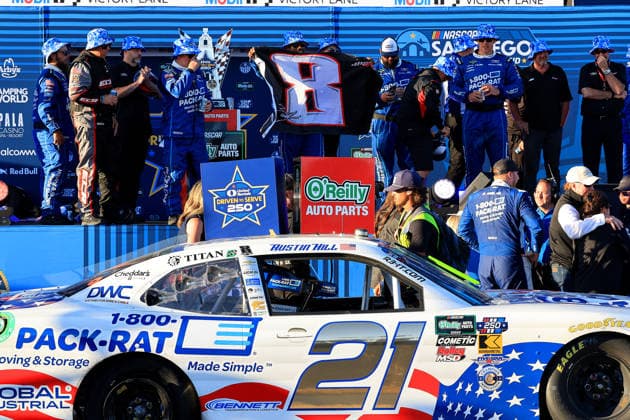 SAN DIEGO, CA - JUNE 20: An RCR crewman holds up a 8 flag in memory of the late Kyle Busch after Austin Hill ( 21 Richard Childress Racing 1-800-PACK-RAT Chevrolet) won the NASCAR, Motorsport, USA Cup Series Anduril 250 Race the Base race on Saturday June 20, 2026 at Naval Base Coronado in San Diego, CA. (Photo by David J. Griffin Icon Sportswire) AUTO: JUN 20 NASCAR Cup Series Anduril 250 Race the Base EDITORIAL USE ONLY Icon9532606205260