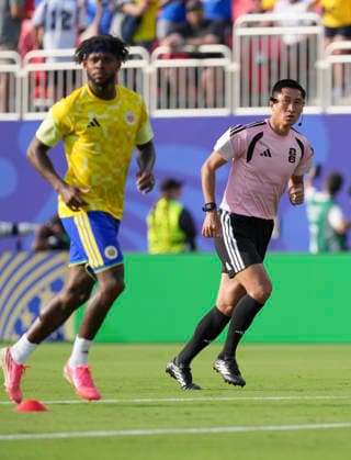 (260621) -- KANSAS CITY, June 21, 2026 -- Head referee Ma Ning (R) of China warms up before the group E match between Ecuador and Curacao at the FIFA World Cup, WM, Weltmeisterschaft, Fussball 2026 at Kansas City Stadium in Kansas City, the United States, June 20, 2026. ) (SP)U.S.-KANSAS CITY-FOOTBALL-FIFA WORLD CUP-GROUP E-ECU VS CUW DuxYu 