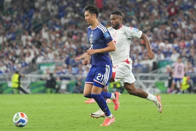 Tunisia v Japan - FIFA World Cup, WM, Weltmeisterschaft, Fussball 2026 - Group F MONTERREY, MEXICO - JUNE 20: Hiroki Ito (21) of Japan in action againstFiras Chaouat (R) of Tunisia during the 2026 FIFA World Cup First Stage Group F match between Tunisia and Japan at Estadio BBVA (Monterrey Stadium) in Monterrey, Mexico on June 20, 2026. Juancho Torres Anadolu Nuevo Leon Mexico. Editorial use only. Please get in touch for any other usage.  Copyright: x2026xAnadoluxJuanchoxTorresx