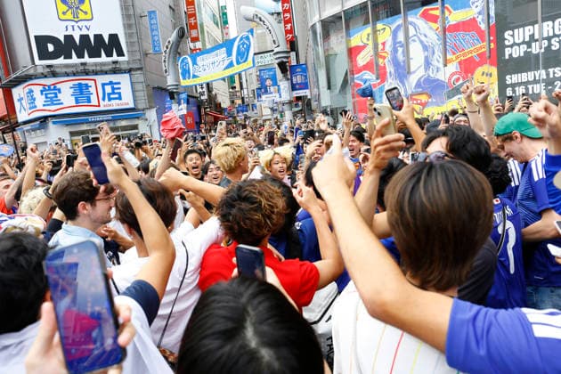 June 21, 2026, Tokyo, Japan: Japanese soccer fans celebrate Japan s victory over Tunisia at the famous Shibuya Scramble Crossing in Tokyo. The Tokyo Metropolitan Police protected the world-famous pedestrian crossing after Japan defeated Tunisia (4Ã¢â‚¬0) in a FIFA World Cup, WM, Weltmeisterschaft, Fussball 2026 Group F match. Tokyo Japan - ZUMAm191 20260621_aap_m191_014 Copyright: xRodrigoxReyesxMarinx