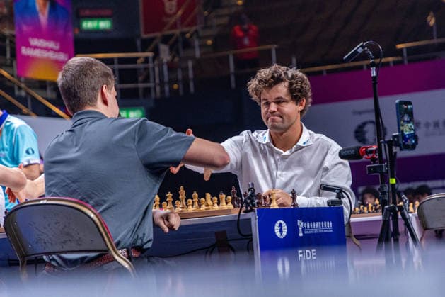 June 21, 2026, Hong Kong, Hong Kong, China: MAGNUS CARLSEN (NOR) shakes hands with VLADISLAV ARTEMIEV (RUS) before the Blitz semifinals tiebreaker at the 2026 FIDE World Team Rapid and Blitz Chess Championship in Hong Kong. WR Chess won the tiebreaker and faces Team MGD1 for fifth place. Hong Kong China - ZUMAm298 0859656141st Copyright: xJamesxModestox