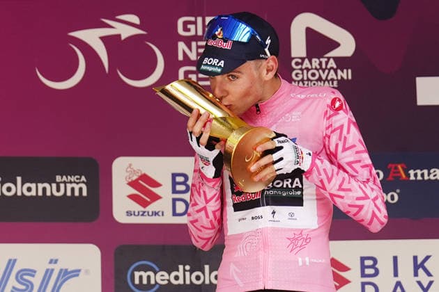 The pink jersey Italy s Lorenzo Mark Finn of Red Bull - Bora - Hansgrohe Rookies first-place celebrate on the podium after the Stage 8 of the Giro Next Gen 2026 Individual Time Trial, from Villa Sant Angelo to L Aquila, Italy, Sunday, June 21, 2026.  Copyright: xFabioxFerrari LaPressex