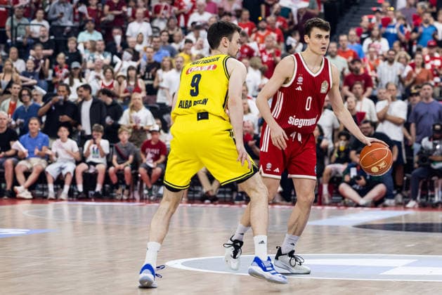 MUNICH, GERMANY - JUNE 21: Neno Dimitrijevic (FC Bayern Muenchen, 0) controls the ball against Jonas Mattisseck (Alba Berlin, 9) during the easyCredit Basketball Bundesliga Playoffs Final Game 5 match between FC Bayern Muenchen vs. Alba Berlin at SAP Garden on June 21, 2026 in Munich, Germany. Bavaria Germany Copyright: xSteffiexWunderlx