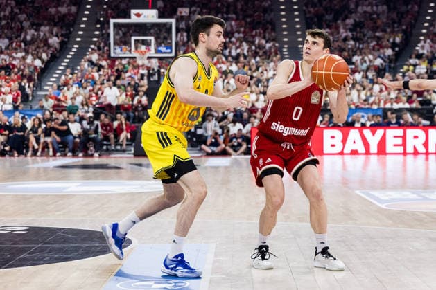 MUNICH, GERMANY - JUNE 21: Neno Dimitrijevic (FC Bayern Muenchen, 0) controls the ball against Jonas Mattisseck (Alba Berlin, 9) during the easyCredit Basketball Bundesliga Playoffs Final Game 5 match between FC Bayern Muenchen vs. Alba Berlin at SAP Garden on June 21, 2026 in Munich, Germany. Bavaria Germany Copyright: xSteffiexWunderlx