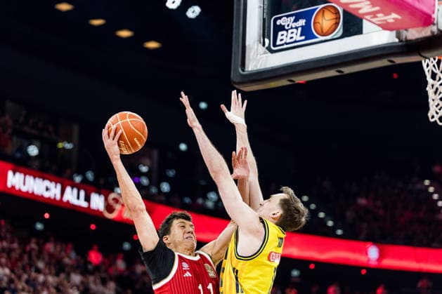MUNICH, GERMANY - JUNE 21: Vladimir Lucic (FC Bayern Muenchen, 11) shooting the ball against Moses Wood (Alba Berlin, 11) during the easyCredit Basketball Bundesliga Playoffs Final Game 5 match between FC Bayern Muenchen vs. Alba Berlin at SAP Garden on June 21, 2026 in Munich, Germany. Bavaria Germany Copyright: xSteffiexWunderlx