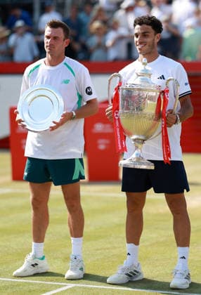 Francisco Cerundolo of Argentina celebrates with the trophy next to Tommy Paul HSBC Queen s Club Championships, Day Sixteen, Tennis, Queen s Club, West Kensington, London, UK - 21 Jun 2026London Queen s Club United Kingdom  Copyright: xEllaxLing Shutterstockx 16929308bv
