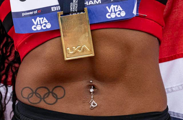 RECORD DATE NOT STATED 21st June 2026; Alexander Stadium, Birmingham, West Midlands, England; 2026 Novuna UK Athletics Championships; Detail of Amber Annings gold medal and Olympic tattoo after winning the women s 400m GodfreyxPitt