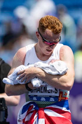 RECORD DATE NOT STATED 21st June 2026; Alexander Stadium, Birmingham, West Midlands, England; 2026 Novuna UK Athletics Championships; Alastair Chalmers of Guernsey AC celebrates winning the final of the mens 400m hurdles and holds his baby GodfreyxPitt