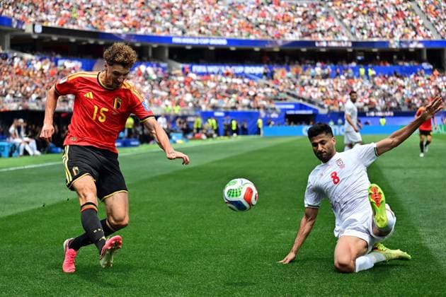 Belgium s Thomas Meunier and Iran s Mohammad Mohebi fight for the ball during a soccer game between Belgian national team, Nationalteam Red Devils and Iran, on Sunday 21 June 2026, at the SoFi stadium in Los Angeles, the second game in the group stage of the FIFA World Cup, WM, Weltmeisterschaft, Fussball 2026 in the United States of America. The Diables Rouges - Rode Duivels were drawn into Group G. DIRKxWAEM  x178649641x