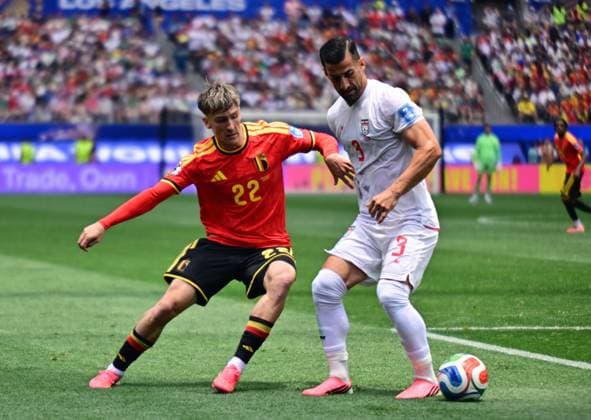 Belgium s Alexis Saelemaekers and Iran s Ehsan Hajsafi fight for the ball during a soccer game between Belgian national team, Nationalteam Red Devils and Iran, on Sunday 21 June 2026, at the SoFi stadium in Los Angeles, the second game in the group stage of the FIFA World Cup, WM, Weltmeisterschaft, Fussball 2026 in the United States of America. The Diables Rouges - Rode Duivels were drawn into Group G. DIRKxWAEM  x178650402x