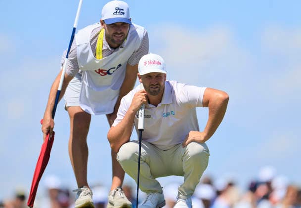 Wyndham Clark and his caddie line up a putt on the 1st green during the final round of the 126th U.S. Open Golf Championship at Shinnecock Hills Golf Club in Southampton, NY, on Sunday, June 21, 2026.  NYC20260621847 COREYxSIPKIN