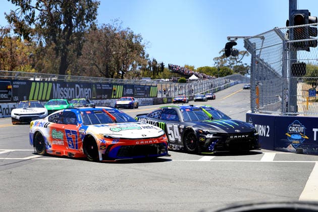 SAN DIEGO, CA - JUNE 21: Corey Heim ( 67 23XI Open MOBIL 1 O REILLY AUTO PARTS Toyota) and Ty Gibbs ( 54 Joe Gibbs Racing Monster Energy Toyota) battle into Turn 2 during the NASCAR, Motorsport, USA Cup Series Anduril 250 Race the Base event on Sunday June 21, 2026 at the Naval Base Coronado in San Diego, CA. (Photo by David J. Griffin Icon Sportswire) AUTO: JUN 21 NASCAR Cup Series Anduril 250 Race the Base EDITORIAL USE ONLY Icon953260621531