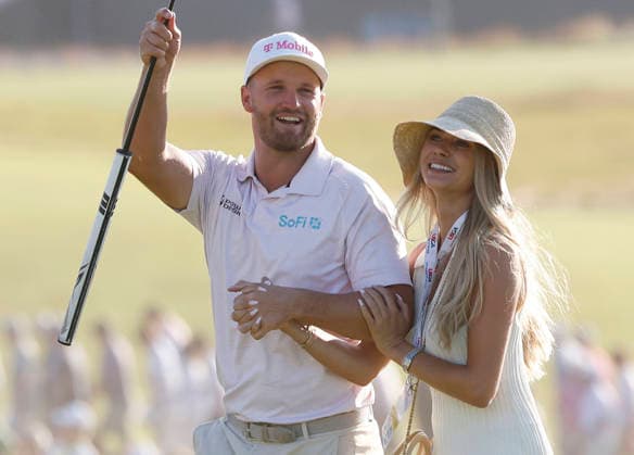 Wyndham Clark celebrates with his girlfriend Emily Tanner after winning the 126th U.S. Open Golf Championship at Shinnecock Hills Golf Club in Southampton, NY, on Sunday, June 21, 2026. Clark won with a four-under-par score of 276.  NYC20260621902 JOHNxANGELILLO