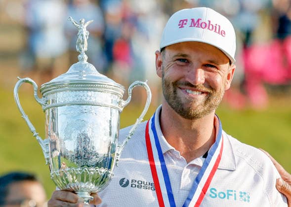 Wyndham Clark poses with the trophy after winning the 126th U.S. Open Golf Championship at Shinnecock Hills Golf Club in Southampton, NY, on Sunday, June 21, 2026. Clark won with a four-under-par score of 276.  NYC20260621922 JOHNxANGELILLO