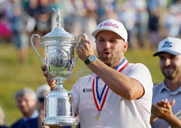 Wyndham Clark poses with the trophy after winning the 126th U.S. Open Golf Championship at Shinnecock Hills Golf Club in Southampton, NY, on Sunday, June 21, 2026. Clark won with a four-under-par score of 276.  NYC20260621931 JOHNxANGELILLO