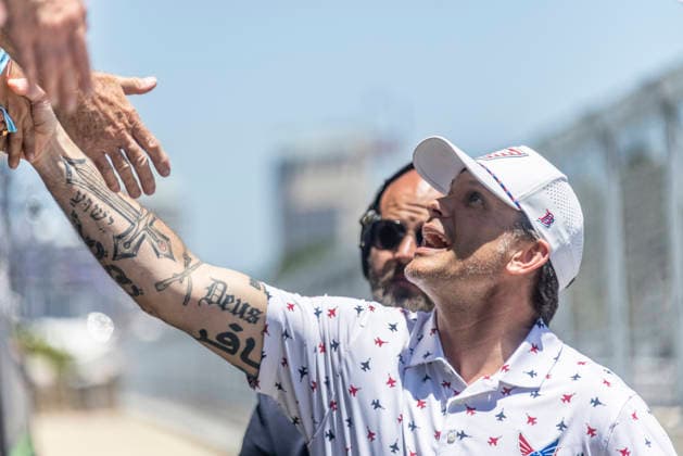 SAN DIEGO, CA - JUNE 21: Secretary of Defense Pete Hegseth shakes hands with race fans after waving the green flag to start the Anduril 250 NASCAR, Motorsport, USA Cup Series Race, Sunday, June 21, 2026, at Naval Base Coronado in San Diego, California. (Photo by Tony Ding Icon Sportswire) AUTO: JUN 21 NASCAR Cup Series Anduril 250 Race the Base EDITORIAL USE ONLY Icon46520260621016250