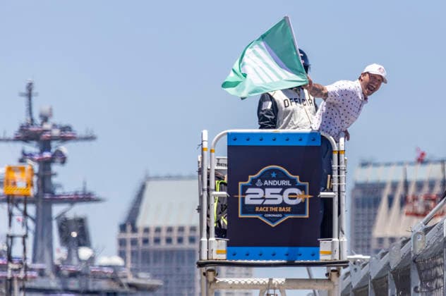 SAN DIEGO, CA - JUNE 21: Secretary of Defense Pete Hegseth waves the green flag to start the Anduril 250 NASCAR, Motorsport, USA Cup Series Race, Sunday, June 21, 2026, at Naval Base Coronado in San Diego, California. (Photo by Tony Ding Icon Sportswire) AUTO: JUN 21 NASCAR Cup Series Anduril 250 Race the Base EDITORIAL USE ONLY Icon46520260621017250