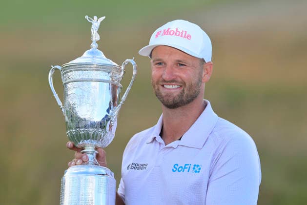 Wyndham Clark holds his trophy after winning the 126th U.S. Open Golf Championship at Shinnecock Hills Golf Club in Southampton, NY, on Sunday, June 21, 2026. Clark won with a four-under-par score of 276.  NYC20260621958 COREYxSIPKIN