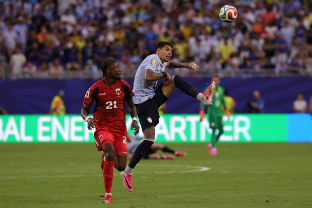 FIFA World Cup, WM, Weltmeisterschaft, Fussball 2026 - Group H - Uruguay vs Cape Verde Nuno da Costa of Cape Verde (L) in action against Mathias Olivera of Uruguay (R) during the FIFA World Cup 2026 group stage match Uruguay against Cape Verde, in Miami, Florida, USA, 21 June 2026. MIAMI United States  Copyright: xCRISTOBALxHERRERA-ULASHKEVICHx